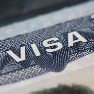 close-up-visa-spamp-passport-immigration-emigration-concept