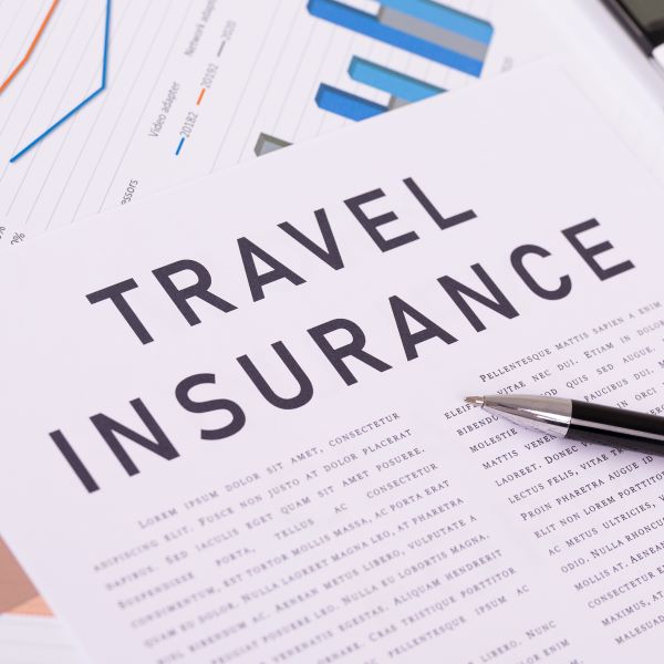 travel-insurance-concept-documents-on-the-desktop-2023-11-27-05-13-55-utc